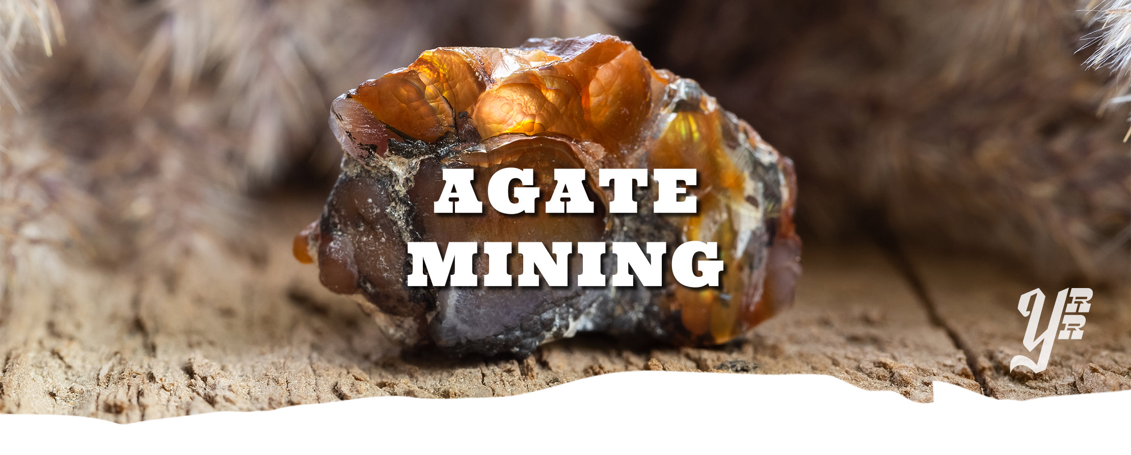 Agate stone on a wooden surface with 'Agate Mining' text overlay