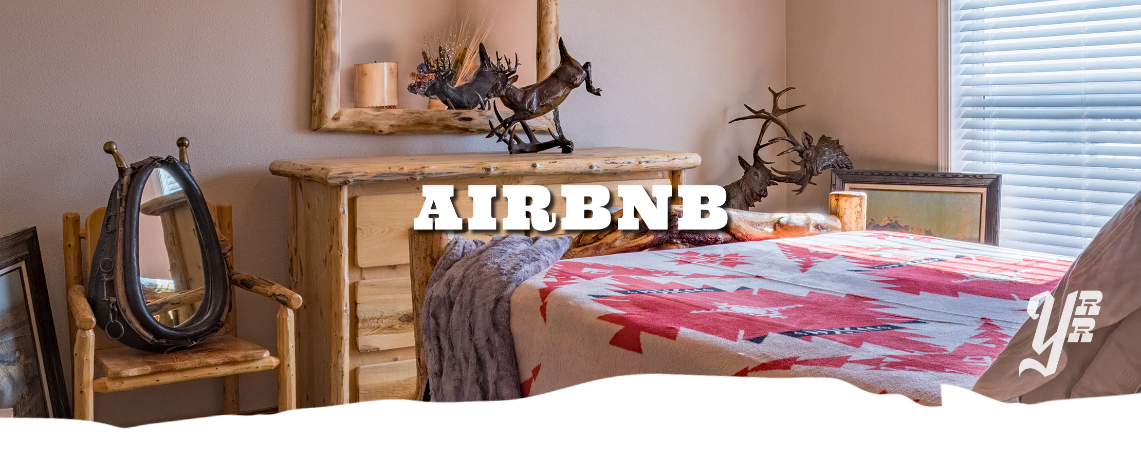 Room interior with wooden dresser, chair, and bed with colorful blanket, featuring 'Airbnb' text overlay