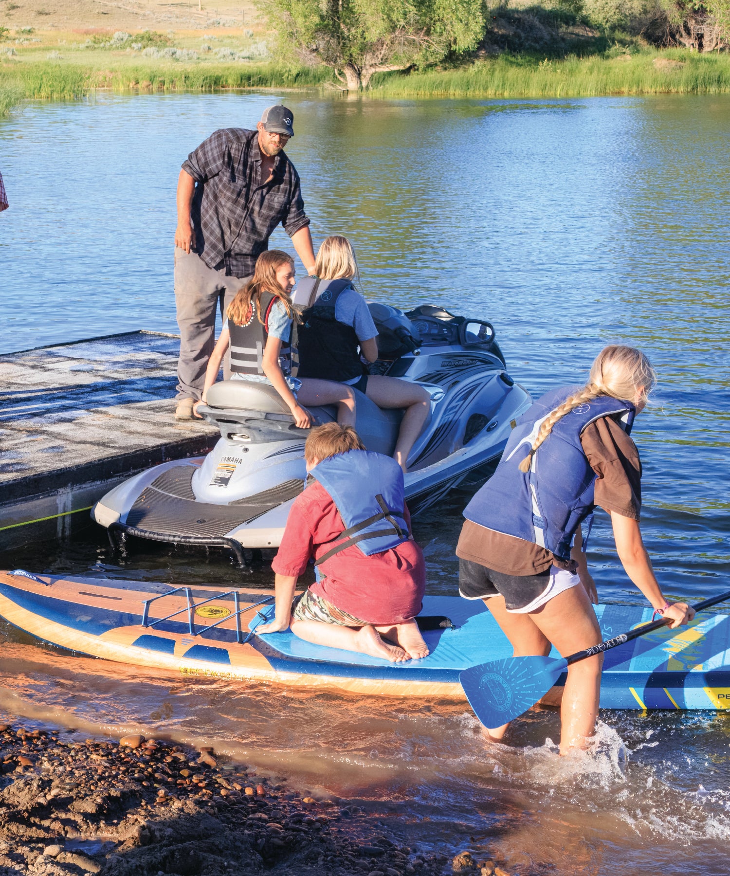 Group of people preparing for water activities on the Yellowstone River