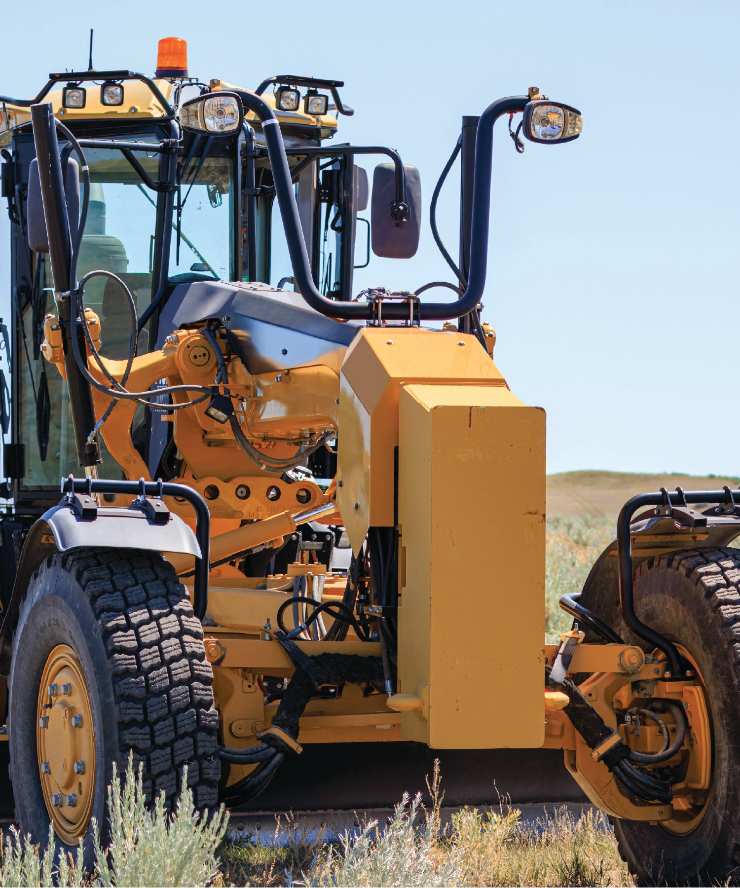 Close-up of a yellow tractor in a field