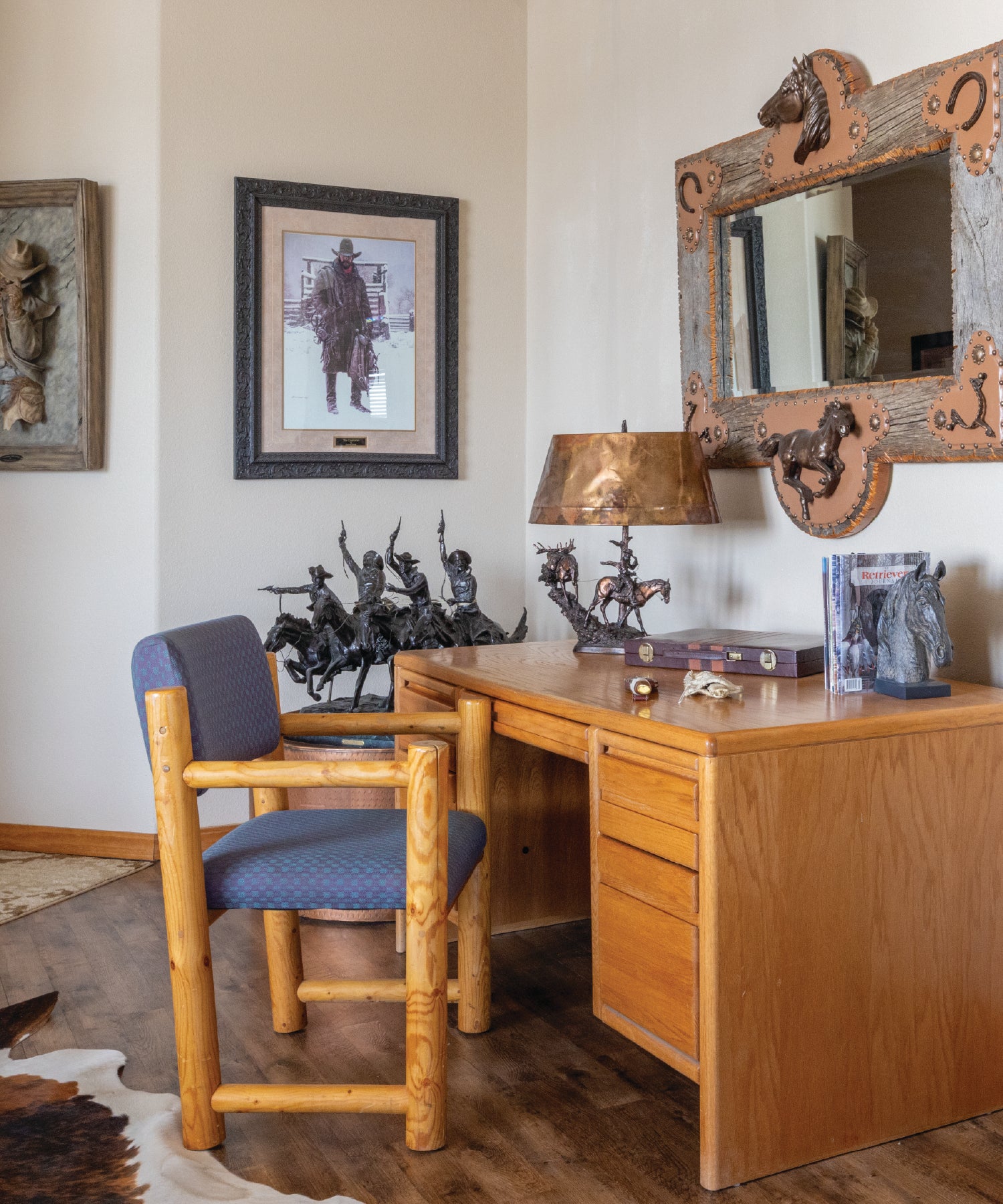 Wooden desk with chair, framed picture, and decorative items in a room