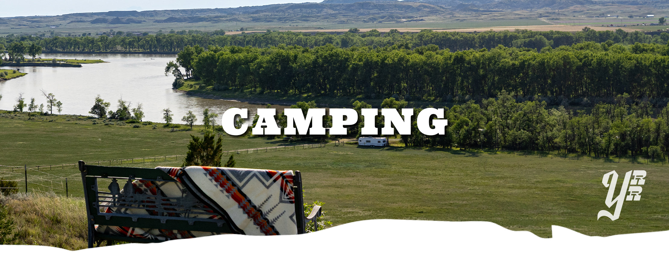 Camping scene with a lake, trees, and a 'camping' text overlay